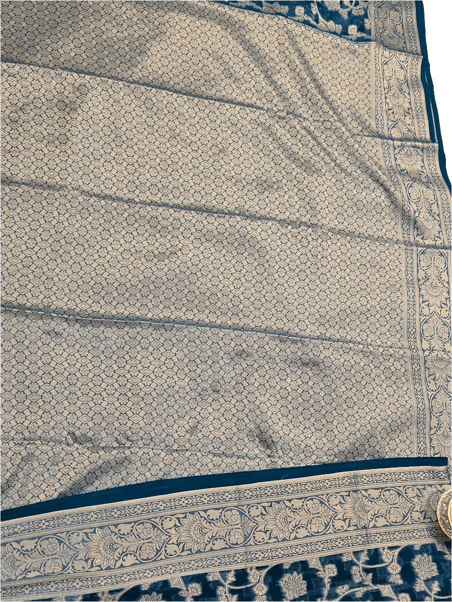Attractive Blue Color Banarasi Silk Saree With Silver Flower Design And Grand