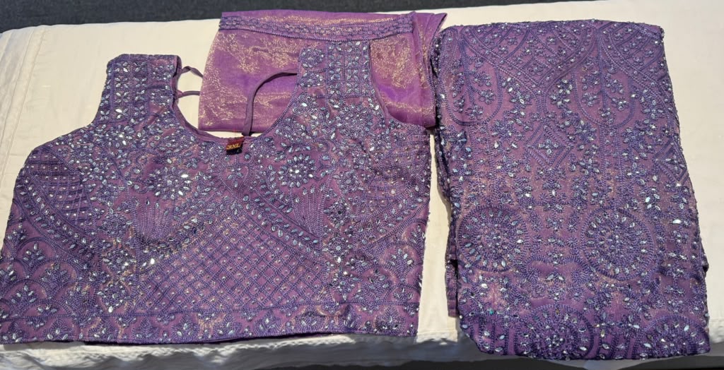 Fanciable Purple Color Net Fabric Lehengas With Embroidery And Mirror Work For Women