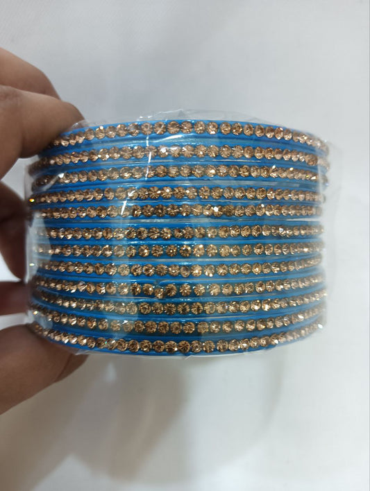 Pleasing Blue Color Glass Bangles With Flashing Gold Stone For Women