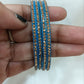 Pleasing Blue Color Glass Bangles With Flashing Gold Stone Near Me