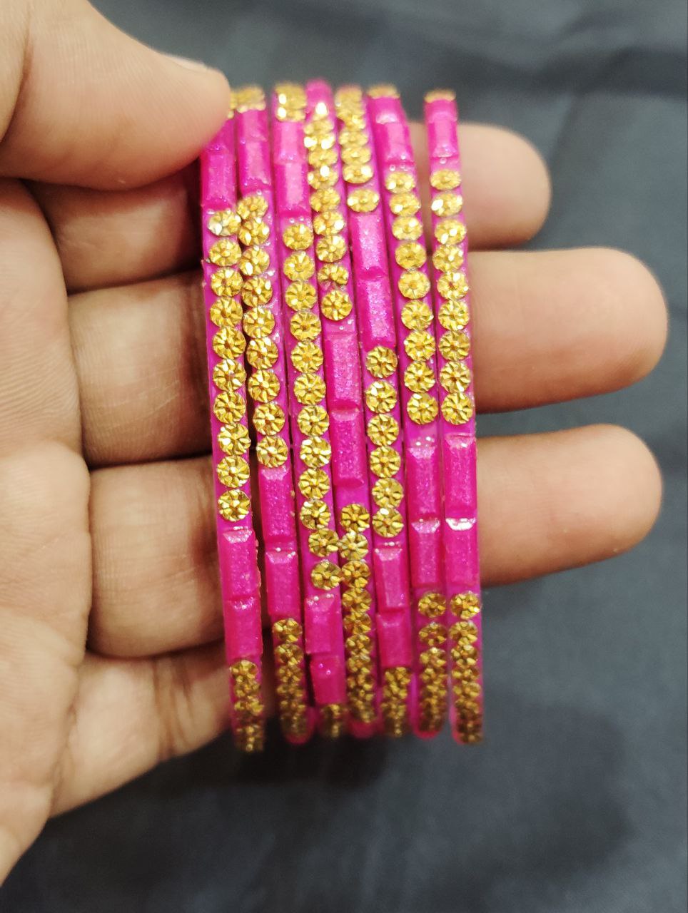 Alluring Rani Pink Color Stone Work Glass Bangles For Women