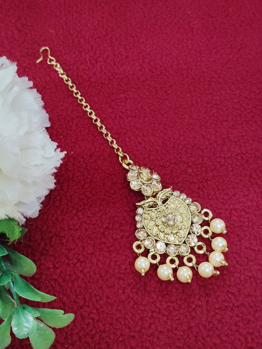 Beautiful gold tikka with pearls and stones