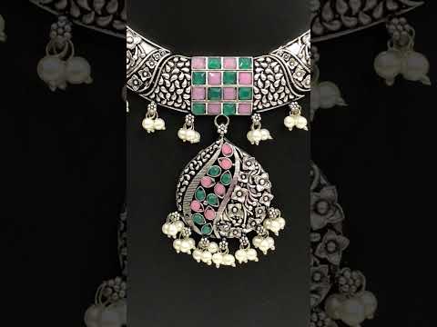 Charming Oxidized Floral Choker Necklace Set With Emerald And Pink Stone