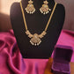 Pretty gold plated white, green and pink stones necklace with pearls.