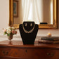Elegant looking fancy gold plated necklace with white stones.