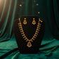 Beautiful gold plated flower shaped necklace set with white, green and pink stones and also pearls.