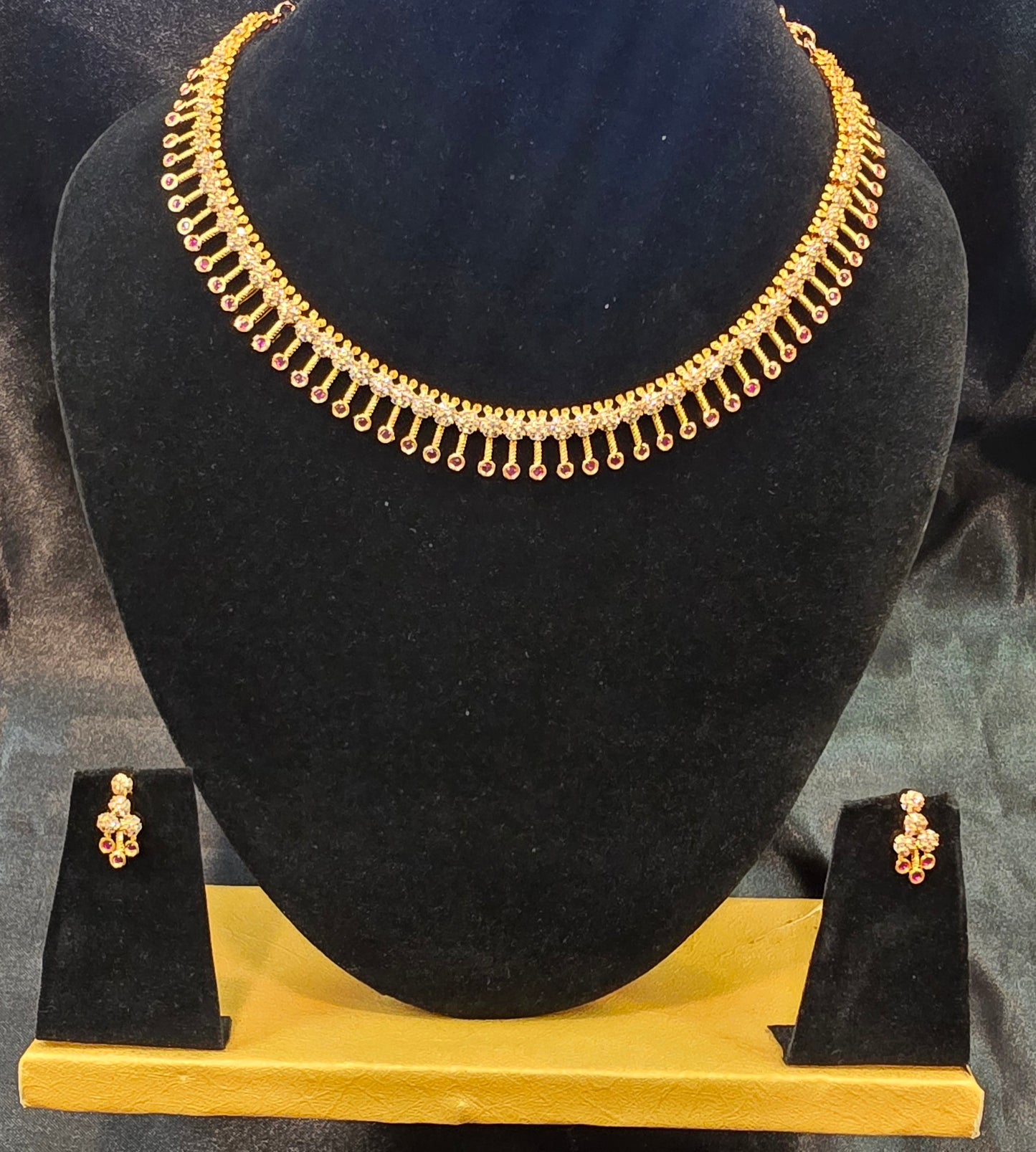 Alluring Dark Pink Color And White Stone Gold Plated Necklace With Earrings Set