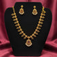 Beautiful gold plated flower shaped necklace set with white, green and pink stones and also pearls.