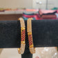 Pleasing Gold Plated Bangles With White And Red Stones