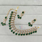 Graceful Gold Plated Dark Green Color Kundan Necklace With Earrings And Maang Tikka