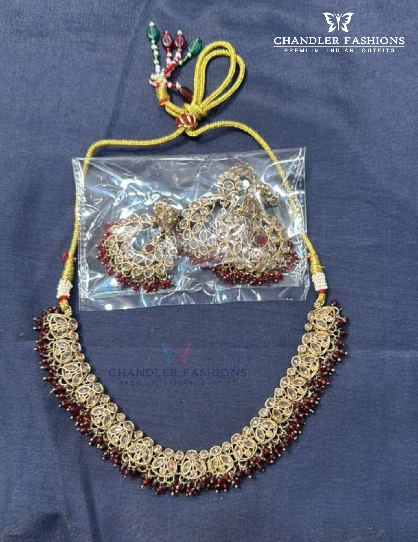 Beautiful Gold Plated Maroon Color Beads And Gold Stones Necklace With Earrings And Maang Tikka