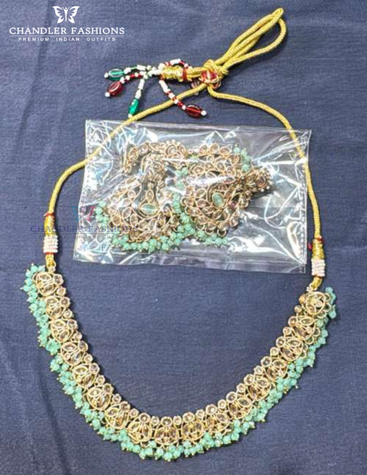 Delightful Light Green Color Beads And Gold Stones Necklace With Earrings And Maang Tikka