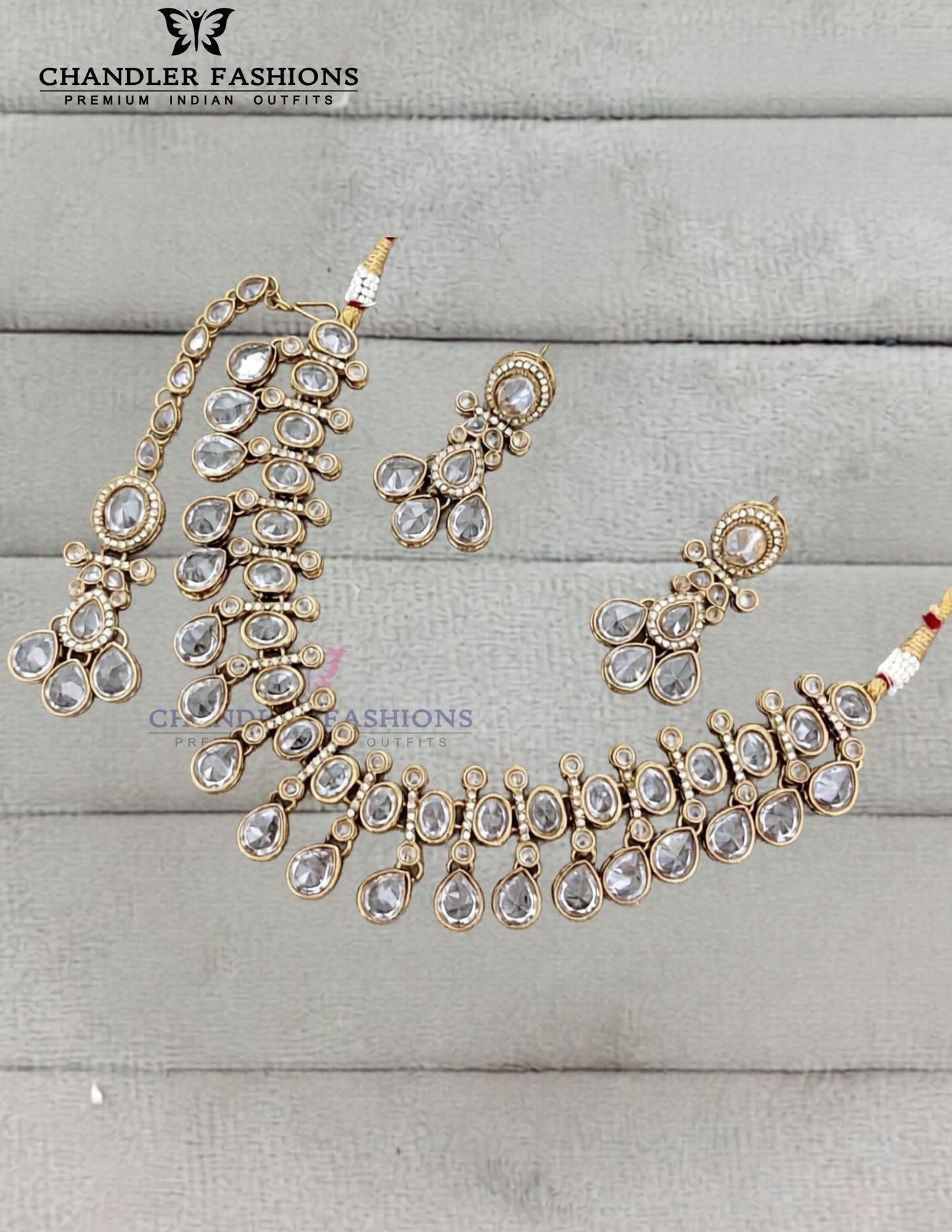 Lovely Gold Plated White Color Kundan Necklace With Earrings And Maang Tikka