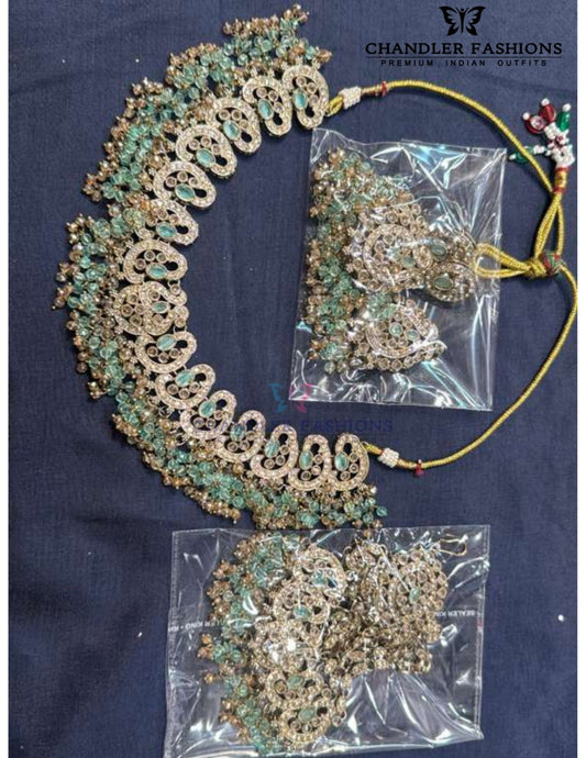 Pretty Antique Gold Light Green Color Kundan Necklace With Earrings And Maang Tikka