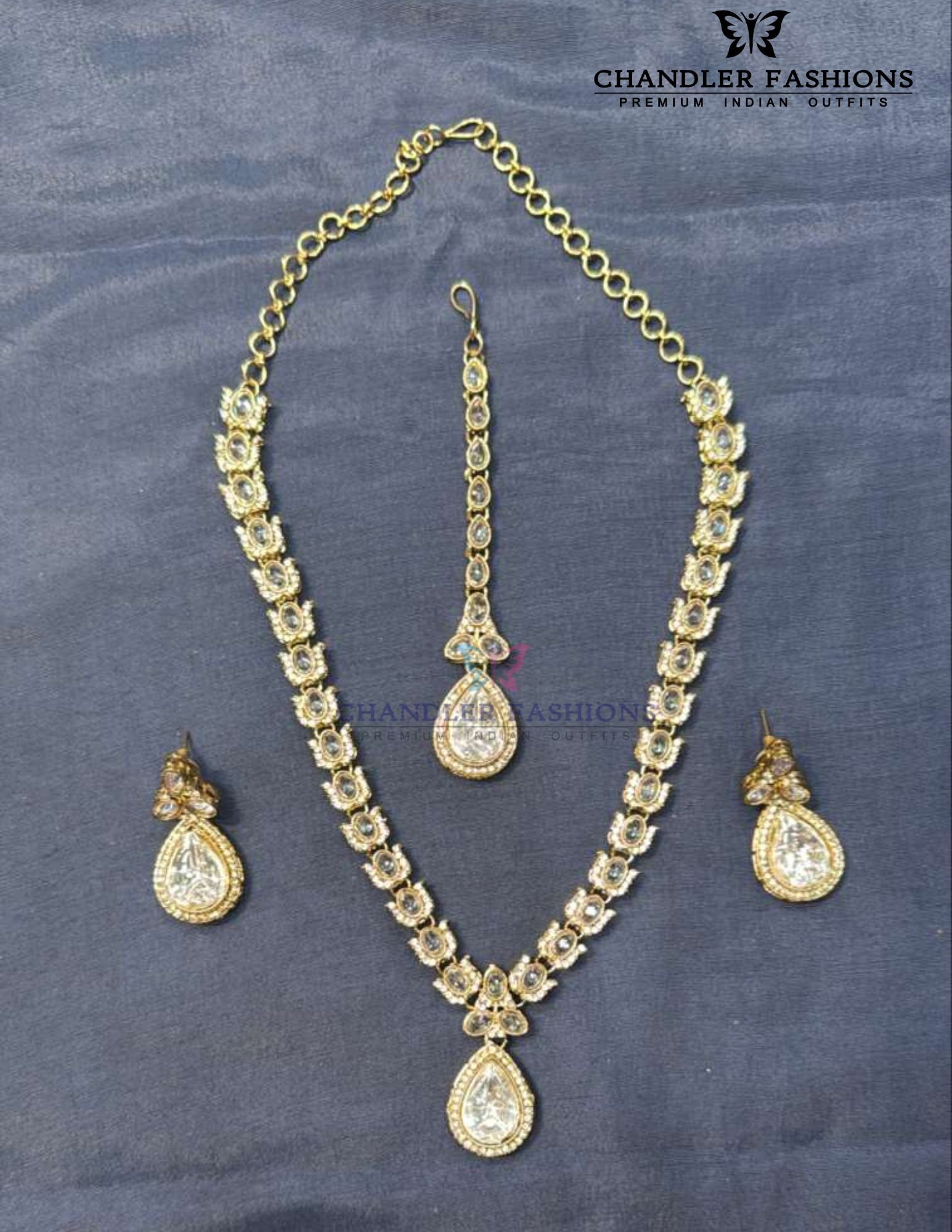 Amazing White Color Stone Embadded Gold Plated Necklace With Earrings And Maang Tikka