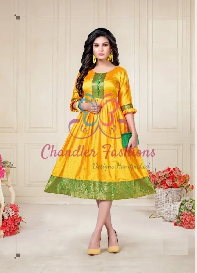 Alluring Yellow Color Aura Silk Kurti With Green Border